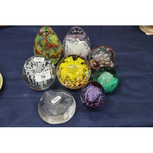 70 - Group of eight glass paperweights, 12cm.