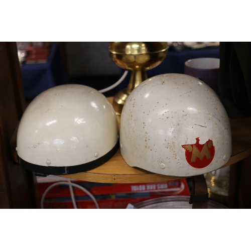 75 - Two vintage motorcycle helmets, also trousers and jacket.