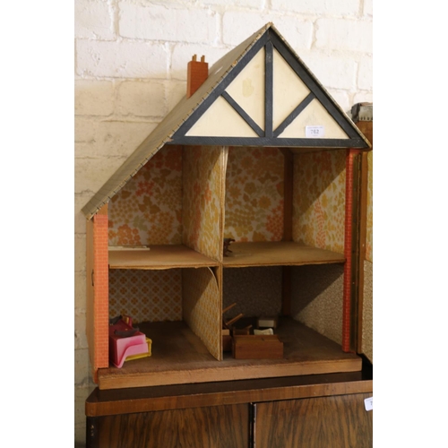 762 - Vintage dolls house with some furniture, 63cm.