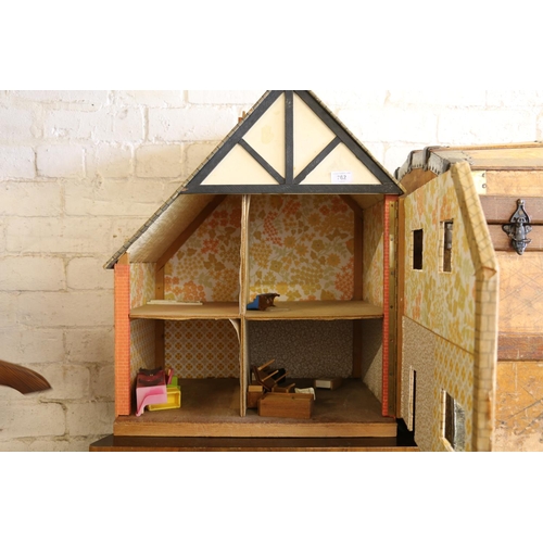 762 - Vintage dolls house with some furniture, 63cm.