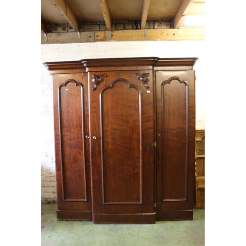 784 - Victorian mahogany breakfron three door wardrobe with arrangment of drawers and hanging spaces, 210 ... 