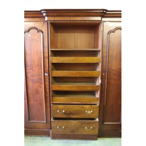 784 - Victorian mahogany breakfron three door wardrobe with arrangment of drawers and hanging spaces, 210 ... 