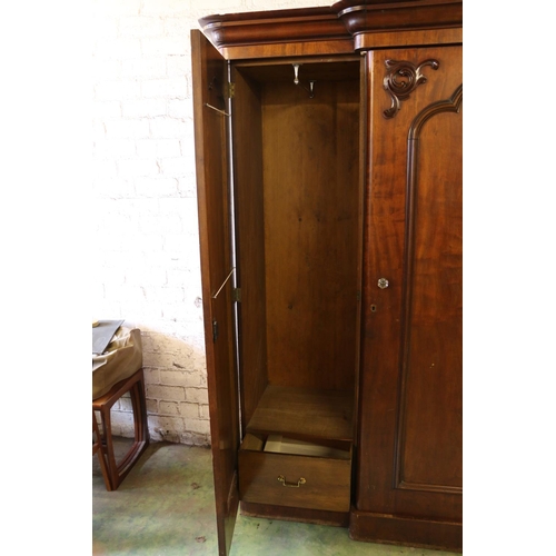 784 - Victorian mahogany breakfron three door wardrobe with arrangment of drawers and hanging spaces, 210 ... 