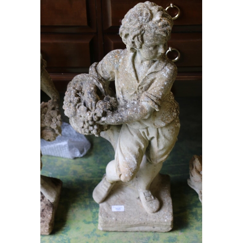 791 - Composite garden statuary of boy carrying basket, 77cm.