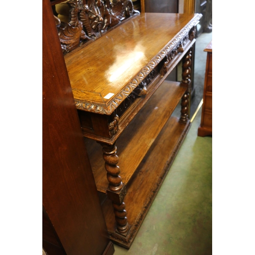 817 - Oak buffett with carved surmount, drawers, and tiers on barley twist supports, 120 x 122 x 50cm.