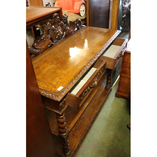 817 - Oak buffett with carved surmount, drawers, and tiers on barley twist supports, 120 x 122 x 50cm.