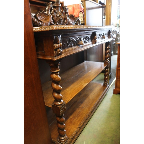 817 - Oak buffett with carved surmount, drawers, and tiers on barley twist supports, 120 x 122 x 50cm.