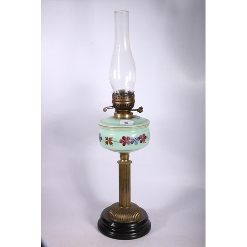 96 - Victorian/Edwardian oil lamp with mint green floral painted reservoir on column support, 67cm.