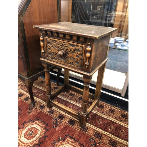 710 - Oak carved lamp table, 73cm.