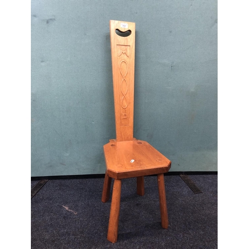 717 - Teak spinning chair with carved back, 95cm.