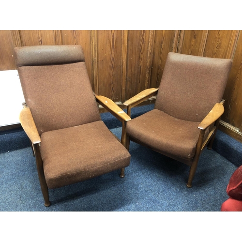 728 - Pair of 1970's teak reclaining arm chairs, 93cm.