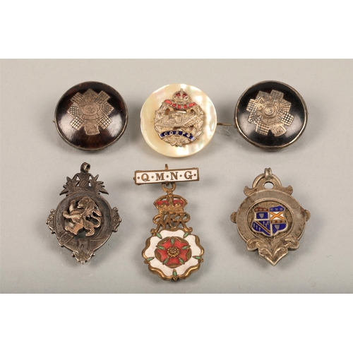 72 - Six assorted medals and brooches some silver, including Queen Mary's Needlework Guild (Queen Mother'... 