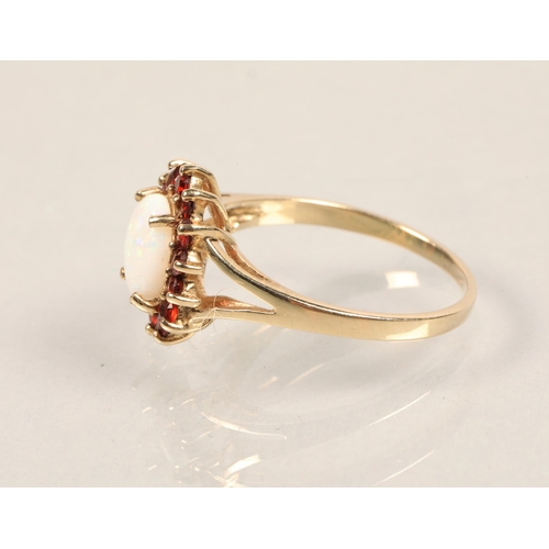 46 - 9ct yellow gold opal and garnet ring. Size: P.