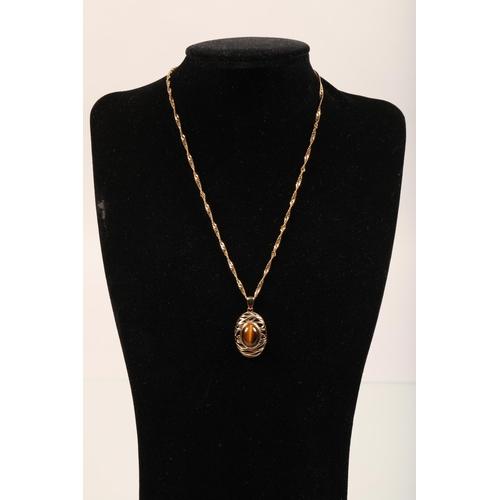 49 - Gold mounted tiger's eye pendant, 9ct. With an 18ct, 5g gold chain.