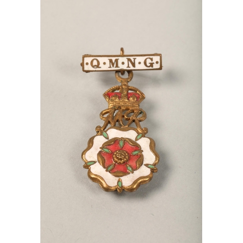 72 - Six assorted medals and brooches some silver, including Queen Mary's Needlework Guild (Queen Mother'... 