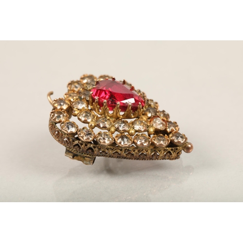 79 - 9ct gold pendant in heart-shaped form with red central stone and white stone surrounding. Length: 2.... 