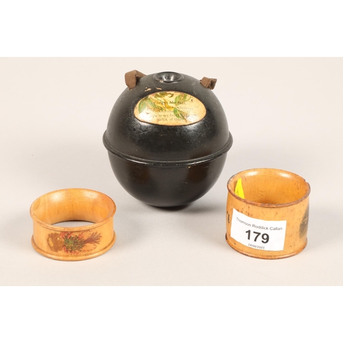 179 - Black 'Forget me not; Mauchline ware sewing cotton ball, with a pair of Mauchline napkin rings (3)