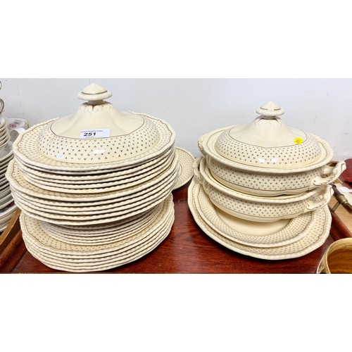 251 - Royal Doulton cream and gilt dinner ware including tureens, tweleve dinner plates etc