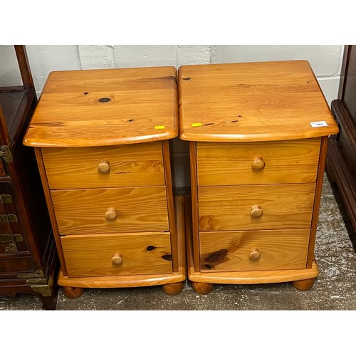 569 - Pair of pine three drawer bedside chests