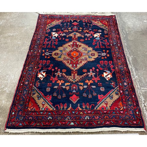 579 - Eastern style patterned rug180 cm x 113 cm