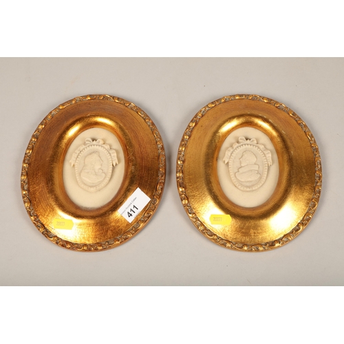 411 - Pair of gilt framed oval plaques21cm x 18cm including frame