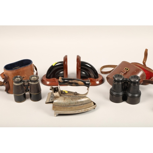 347 - A selection of binoculars, iron, bookends and camera. 