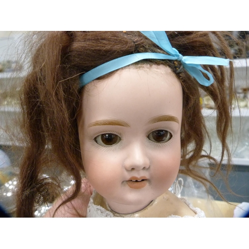 122 - 19th century Simon & Halbig German bisque-headed doll and a christening gown.