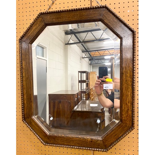 431 - Oak framed octagonal mirror62cm x 52 cm