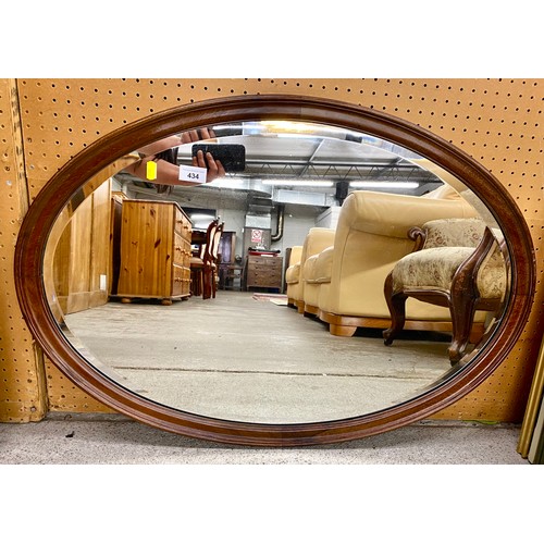 434 - Mahogany framed oval mirror56cm x 82cm