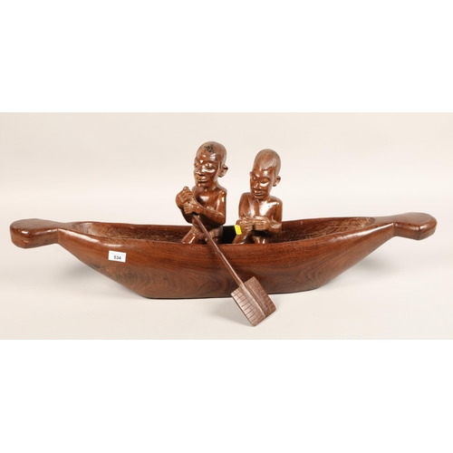 534 - Carved African boat with two figures