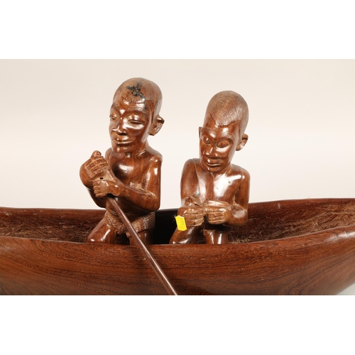 534 - Carved African boat with two figures