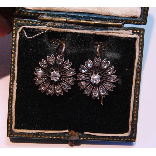 11 - Pair of late Victorian sunflower earrings, each with a brilliant and rose diamonds, in gold and silv... 