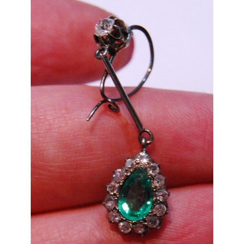 17 - Pair of Edwardian diamond and emerald drop earrings, each with a pear-shaped cluster dependant by a ... 