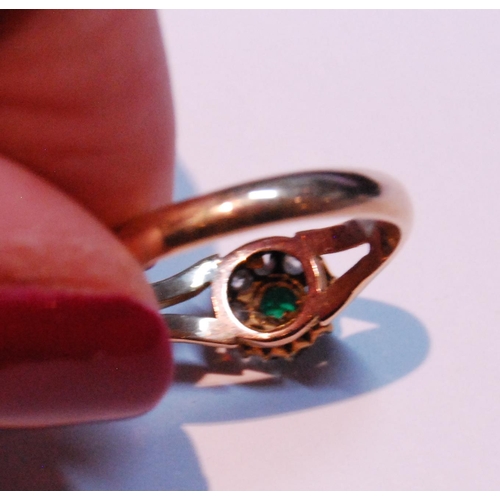 18 - Diamond and emerald cluster ring on bifurcated gold band, size M.