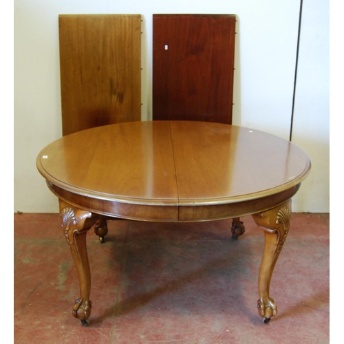 304 - Chippendale Revival mahogany circular dining table with two additional leaves, on moulded cabriole l... 