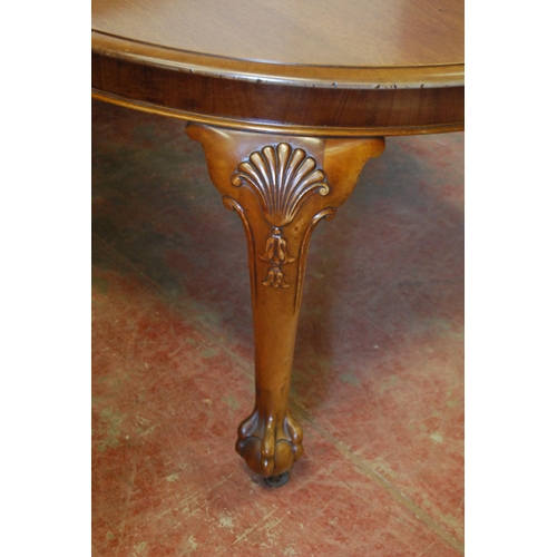 304 - Chippendale Revival mahogany circular dining table with two additional leaves, on moulded cabriole l... 