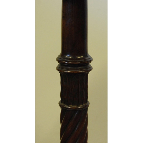 309 - Pair of mahogany torchères, c. early 20th century, each with a saucer top above turned reeded column... 