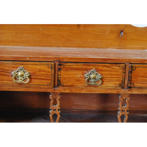 311 - Victorian Scotch pine dresser, the superstructure top with four short drawers above an open recess, ... 