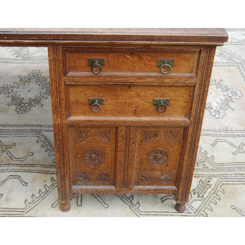 318 - Carved oak partner's desk, c. early 20th century, with tooled skiver above drawers and doors to both... 