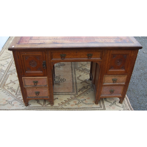 318 - Carved oak partner's desk, c. early 20th century, with tooled skiver above drawers and doors to both... 