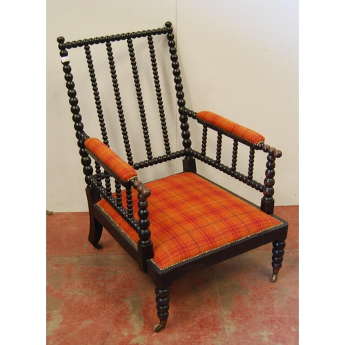 320 - Victorian ebonised bobbin armchair, the arm rests and seat upholstered in later tartan stuff-over fa... 