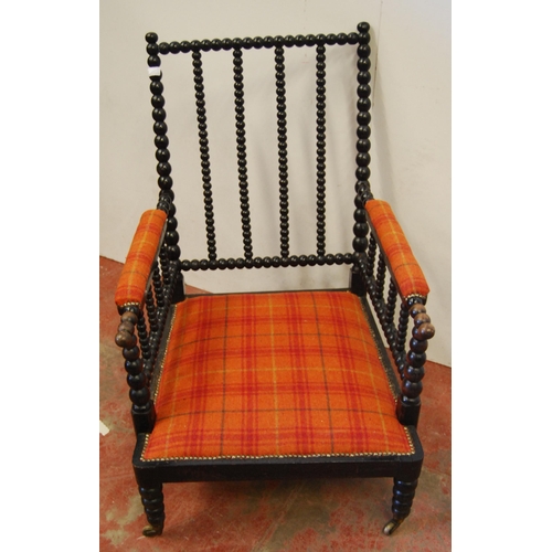 320 - Victorian ebonised bobbin armchair, the arm rests and seat upholstered in later tartan stuff-over fa... 