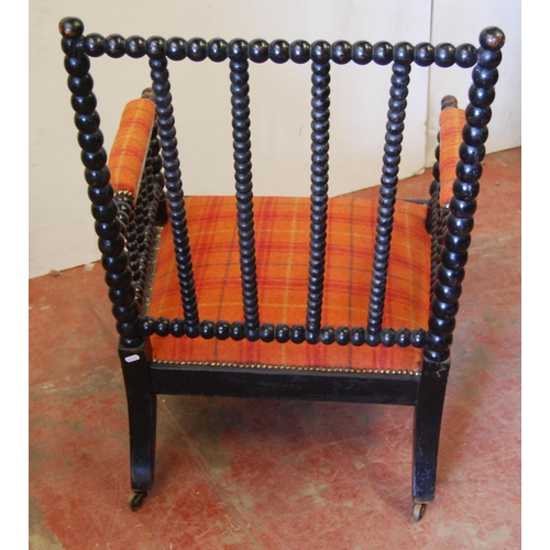 320 - Victorian ebonised bobbin armchair, the arm rests and seat upholstered in later tartan stuff-over fa... 