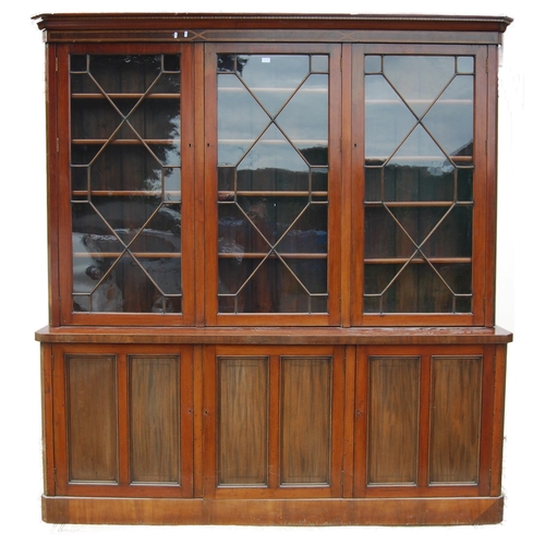 333 - Late Victorian / Edwardian inlaid mahogany library bookcase, the shaped dentil cornice above three a... 