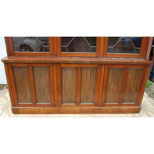 333 - Late Victorian / Edwardian inlaid mahogany library bookcase, the shaped dentil cornice above three a... 