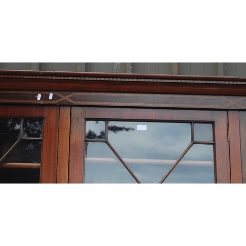 333 - Late Victorian / Edwardian inlaid mahogany library bookcase, the shaped dentil cornice above three a... 