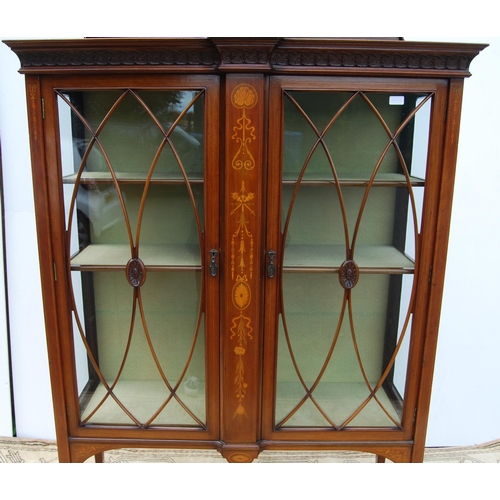 337 - Edwardian inlaid mahogany display cabinet in the manner of Edwards & Roberts, the carved pedimen... 