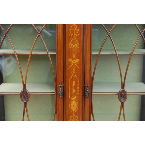 337 - Edwardian inlaid mahogany display cabinet in the manner of Edwards & Roberts, the carved pedimen... 