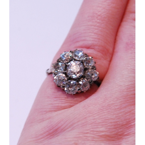 26 - Early 20th century diamond cluster ring with old-cut brilliant, approximately .5ct, surrounded by ei... 