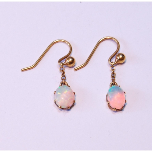 27 - Pair of opal drop earrings, each oval opal dependant from a bead.